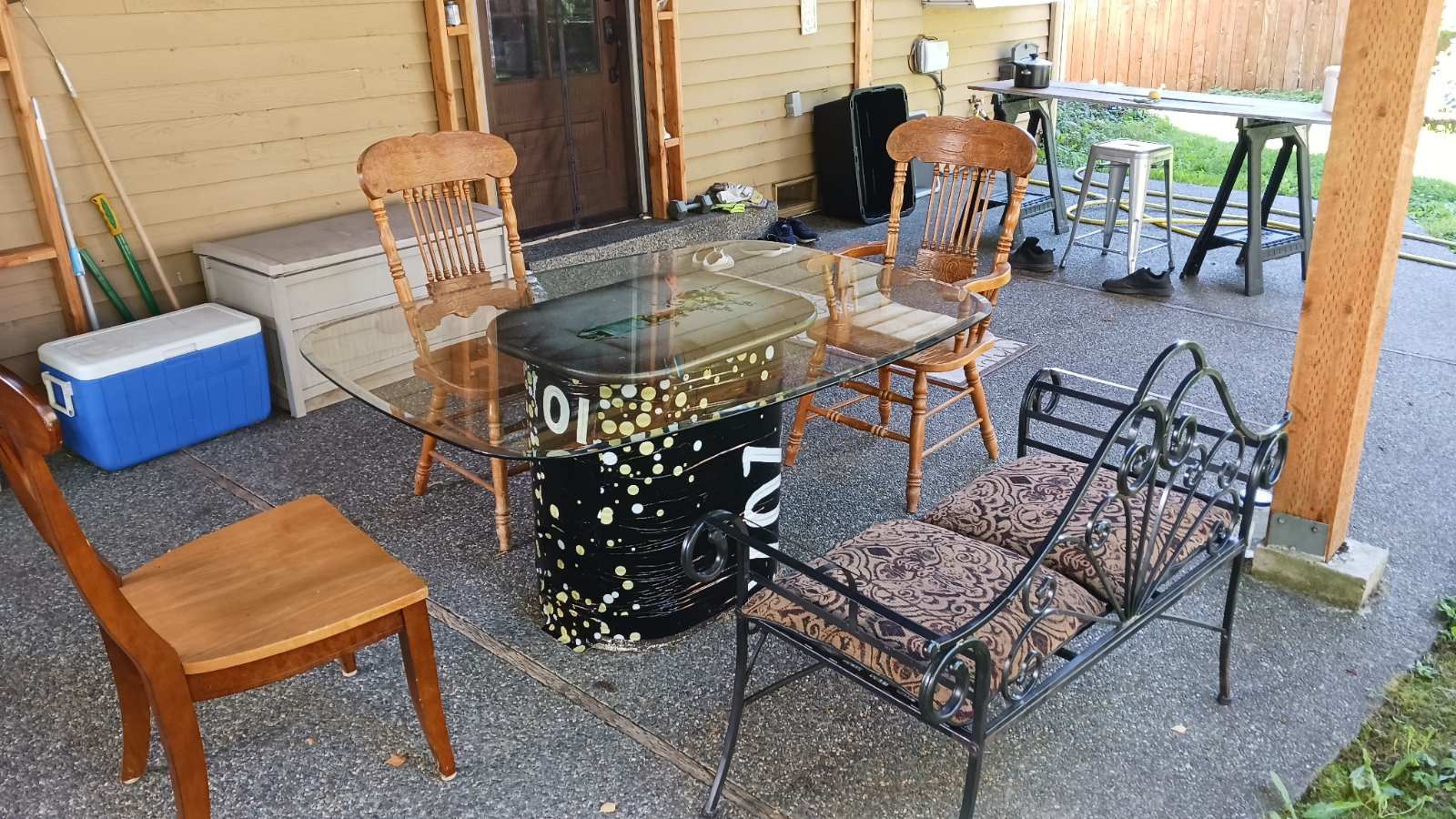 Table and chairs and iron Bench