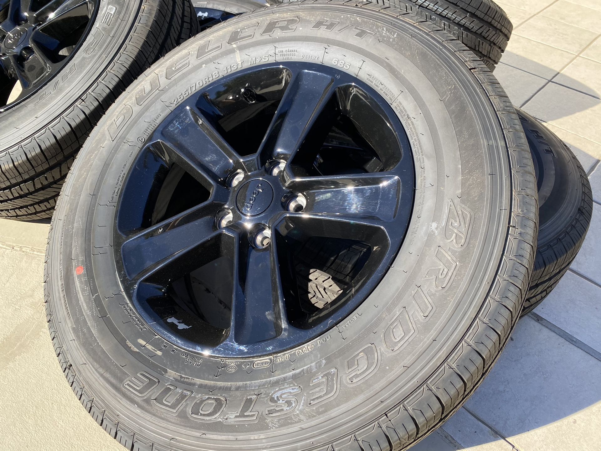 18" OEM Jeep Wrangler Sahara Wheels Gloss Black Bridgestone 255/70/18 New Tires