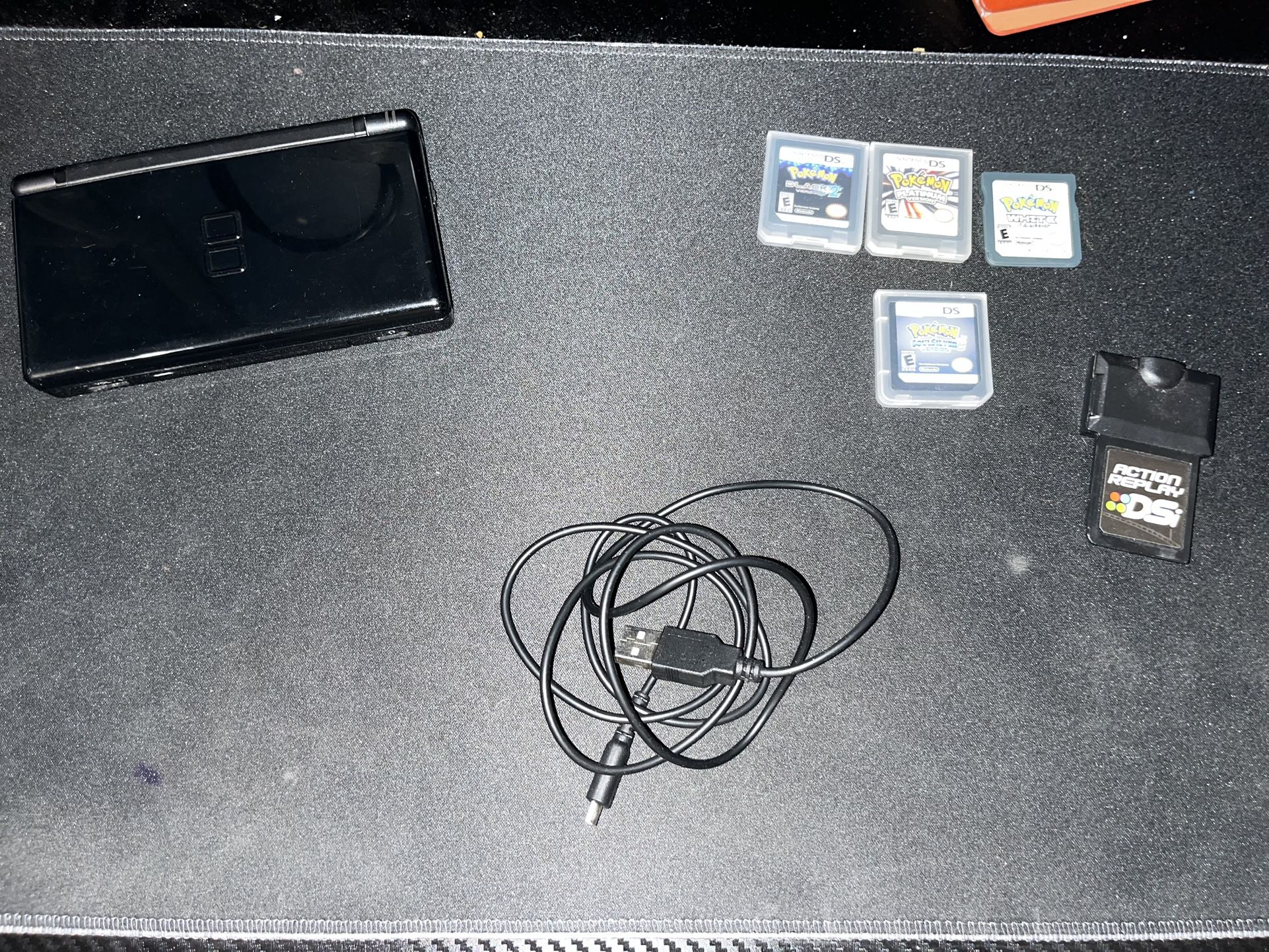 Slightly Nintendo DS with games/accessories