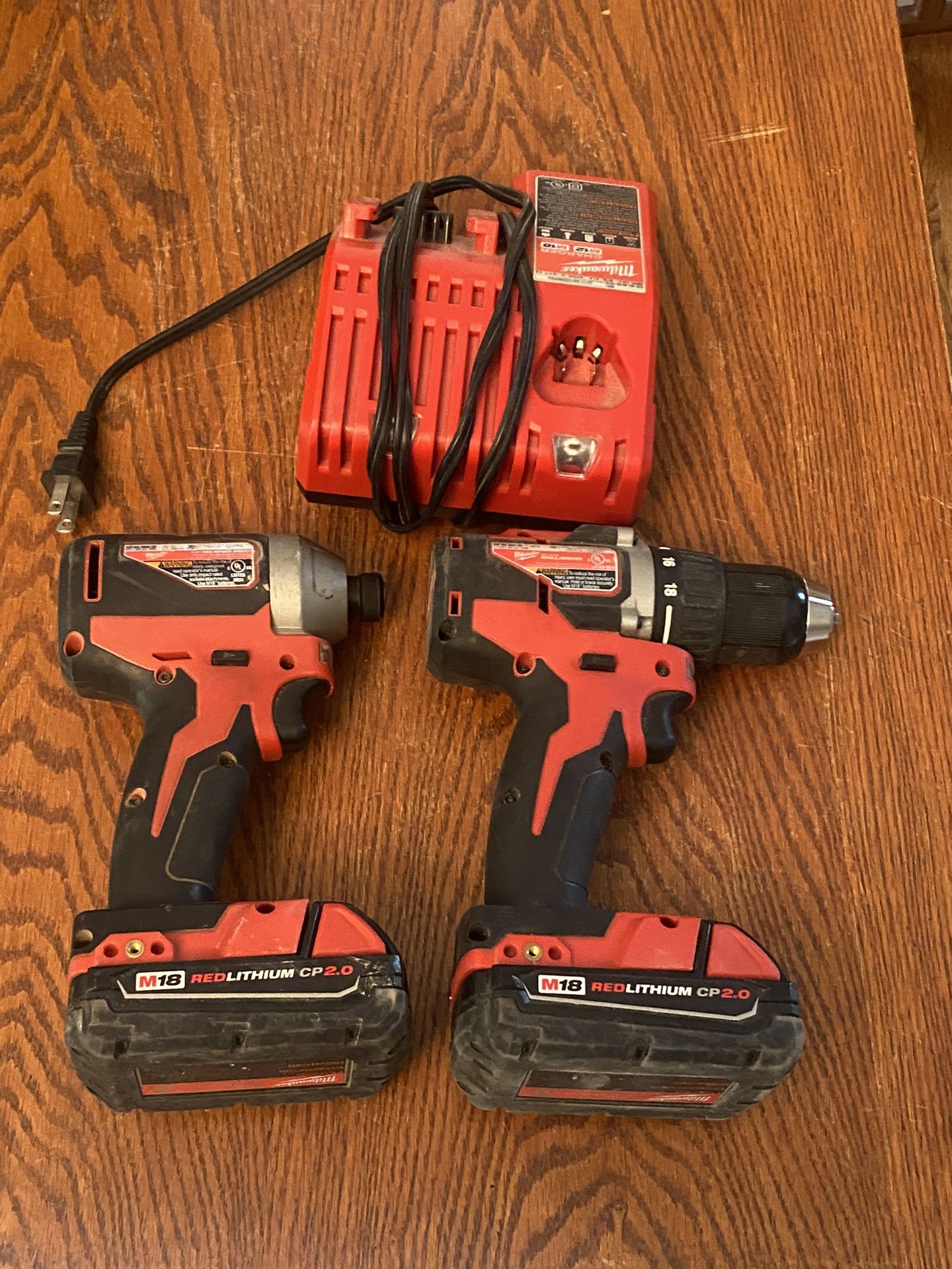 Milwaukee Drill And Impact. Two small batteries and charger