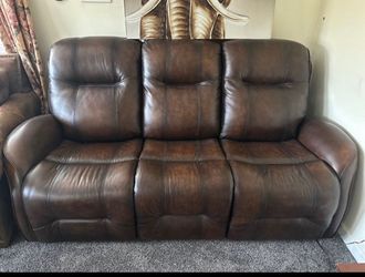 Brown leather reclining sofa