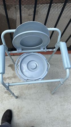 Bedside toilet with grab bar/adjustable legs