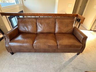 2 leather couches with silver beading