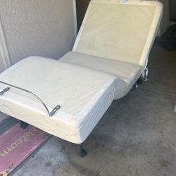 Two Tempur-pedic twin adjustable bases.  with massage . Put Them Together And They Become A Split Cal King Base.