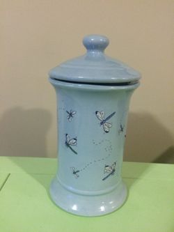 Glass jar with butterflies