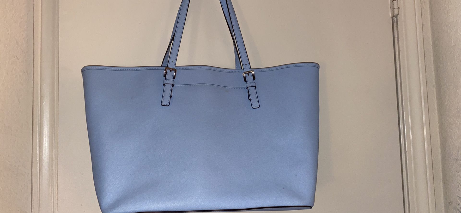 Michael Kors Traditional Tote with a matching wallet. Small stain left bottomed of tote.