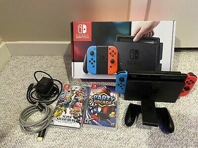 USED NINTENDO SWITCH WITH 2 GAMES (Super Smash Bros Ultimate and Party Arcade)

