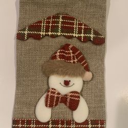 wine cover - new in package- brown with a snowman 12” tall & 5.5” tall