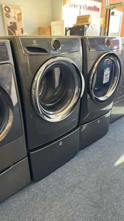 Front Load Electrolux Washer And Dryer Set On Pedestals 
