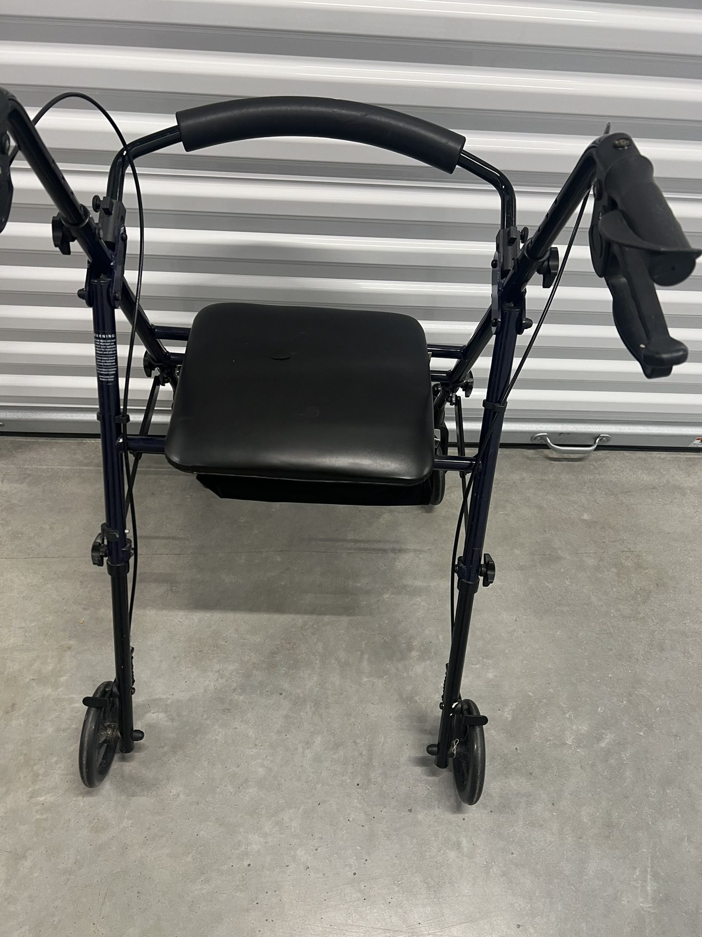 Carex medical walker with seat. Used in good condition with some cosmetic blemishes like scratches and scuff marks from prior usage. There is a small 