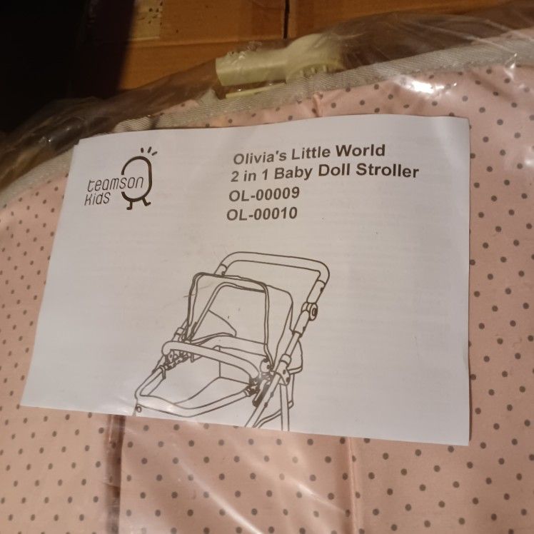 Olivia's Little World baby doll stroller.