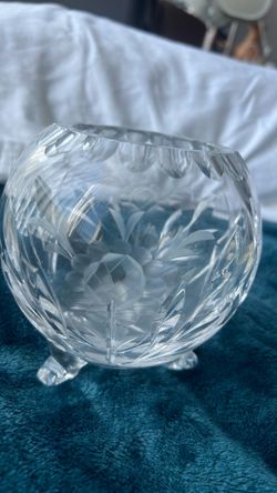 A Tiffany & Co. crystal vase with etched floral and vine motifs.