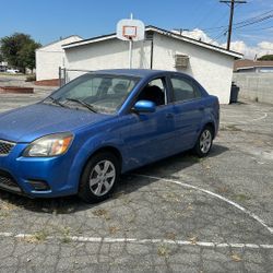 2011 Kia Rio, four-cylinder automatic