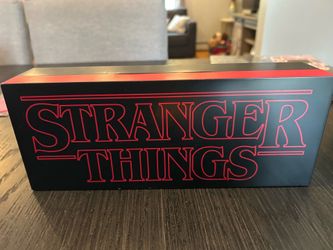 Stranger Things black & red light up sign missing back cover for batteries but works perfectly as shown