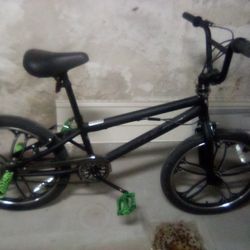 Two Teenagers Stunt Bikes
