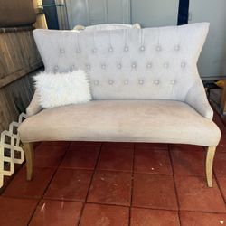 Modern beige two-seater sofa