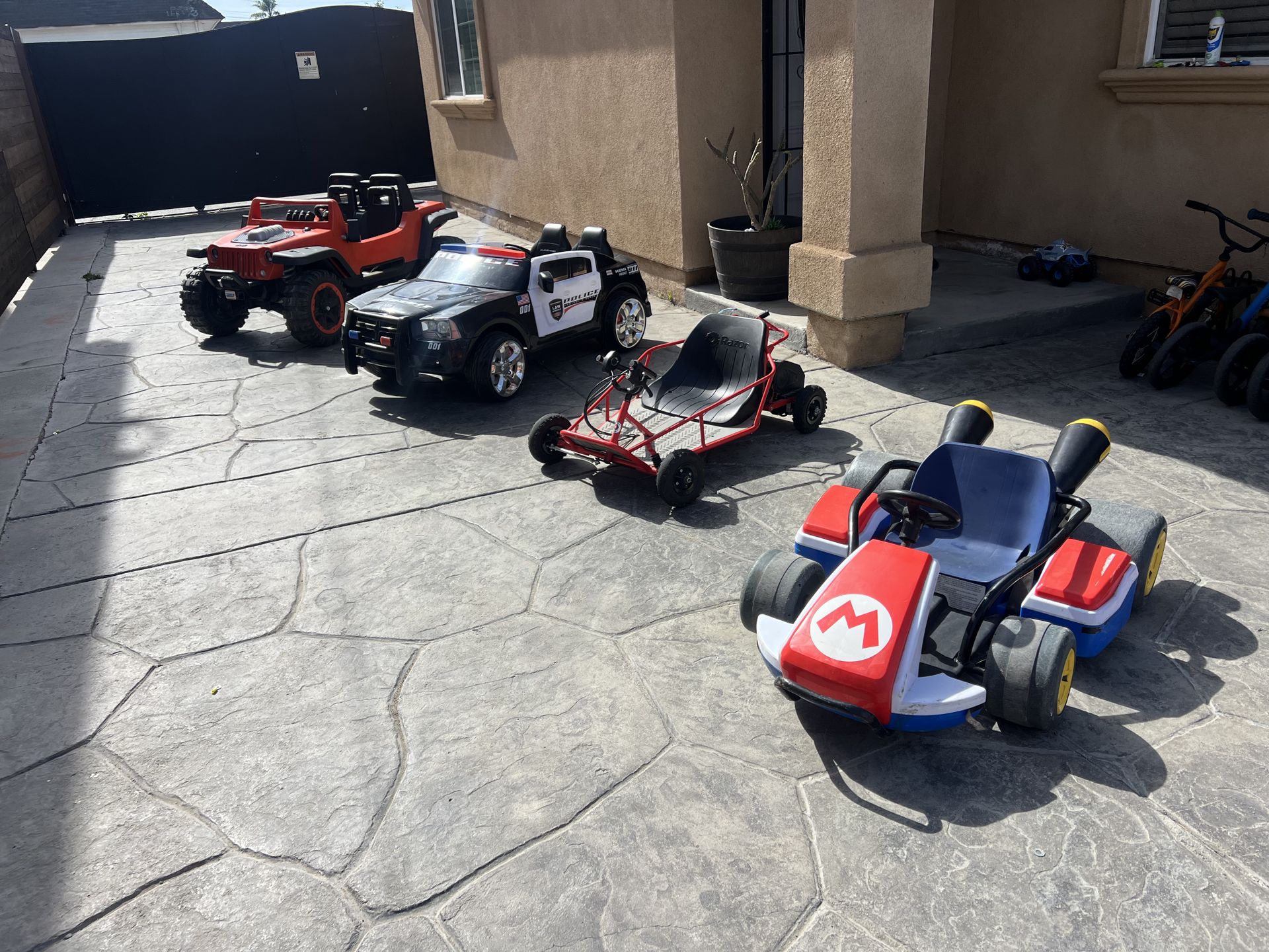 4 power wheels cars jeep 24v comes with charger super strong asking $200 / mario kart 24v comes with charger fast asking $200 / and Razor dube buggy s