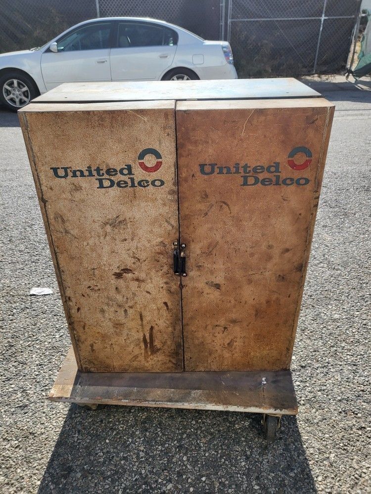 Vintage United Delco brand mechanics wall hanging cabinet originally intended for carburetor parts. AC Delco Garage Shelf Cabinet Case Cherry Bomb Bin