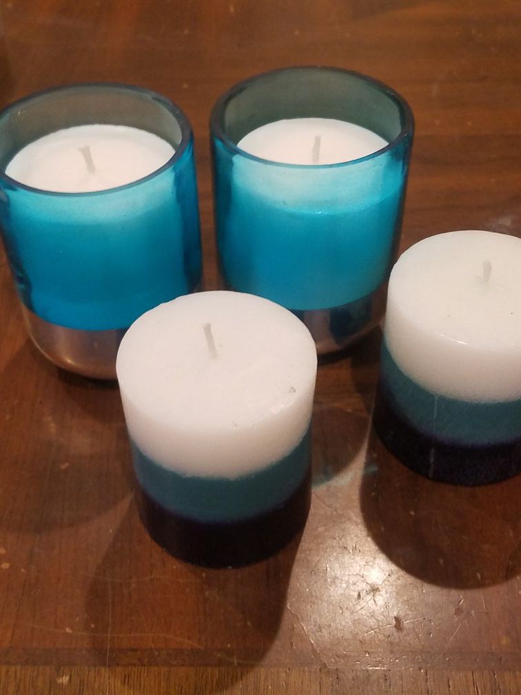 2 Teal, white and dark blue candle. 2 Teal and silvers andle holders with 2 white candle inside.