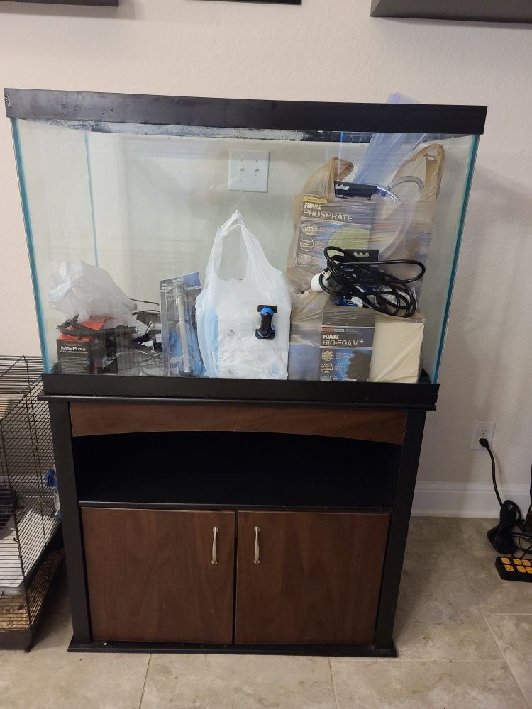 65 Gallon glass fish tank with stand and filter pumps and accessories
