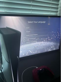 PS5 Digital Slim with red controller