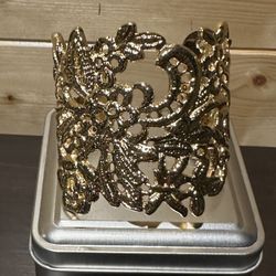Beautiful gold costume jewelry bracelet cuff.