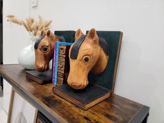 Pair of vintage country style bookends; hand carved wooden pieces shaped like horse heads. Made in Spain.