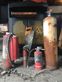 Three Old Fire Extinguishers and a Gas cylinder