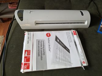 Laminator and 50+ laminating sheets.