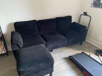 Black couch with footrest