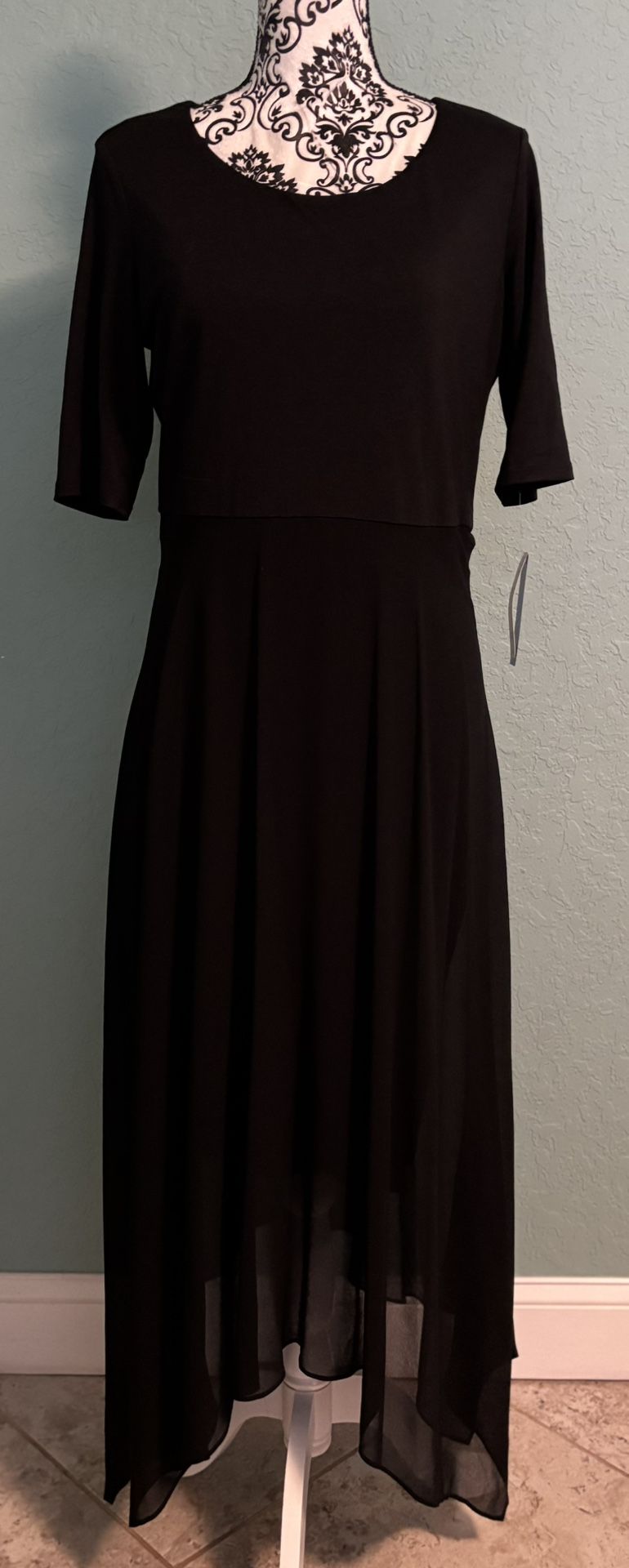 Elegant black high-low dress with short sleeves. NWT