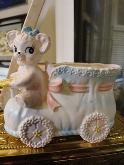 Baby Planter teddy bear driving a Bootie car