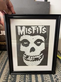 image features the iconic "Fiend Skull" logo of the American horror punk band, the Misfits. This specific piece appears to be a stylized, possibly han