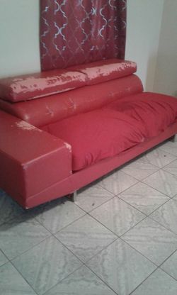 Red couch needs a cover but good condition
