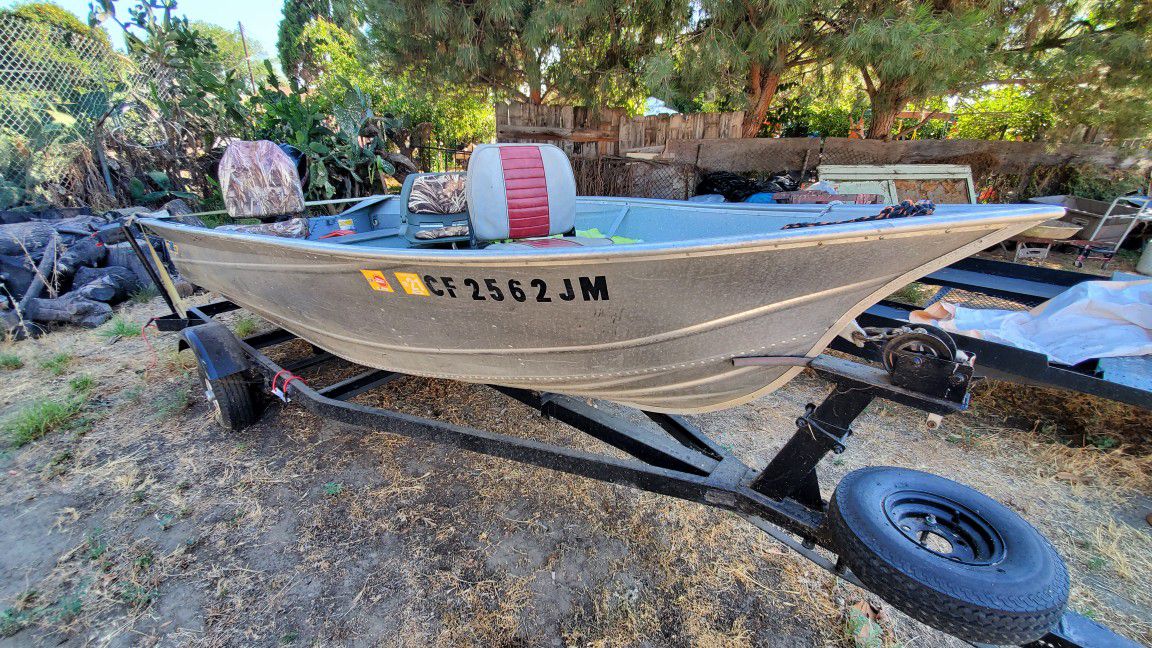 Valco Aluminum Boat With Suzuki DF15A Four Stroke Outboard and Trailer