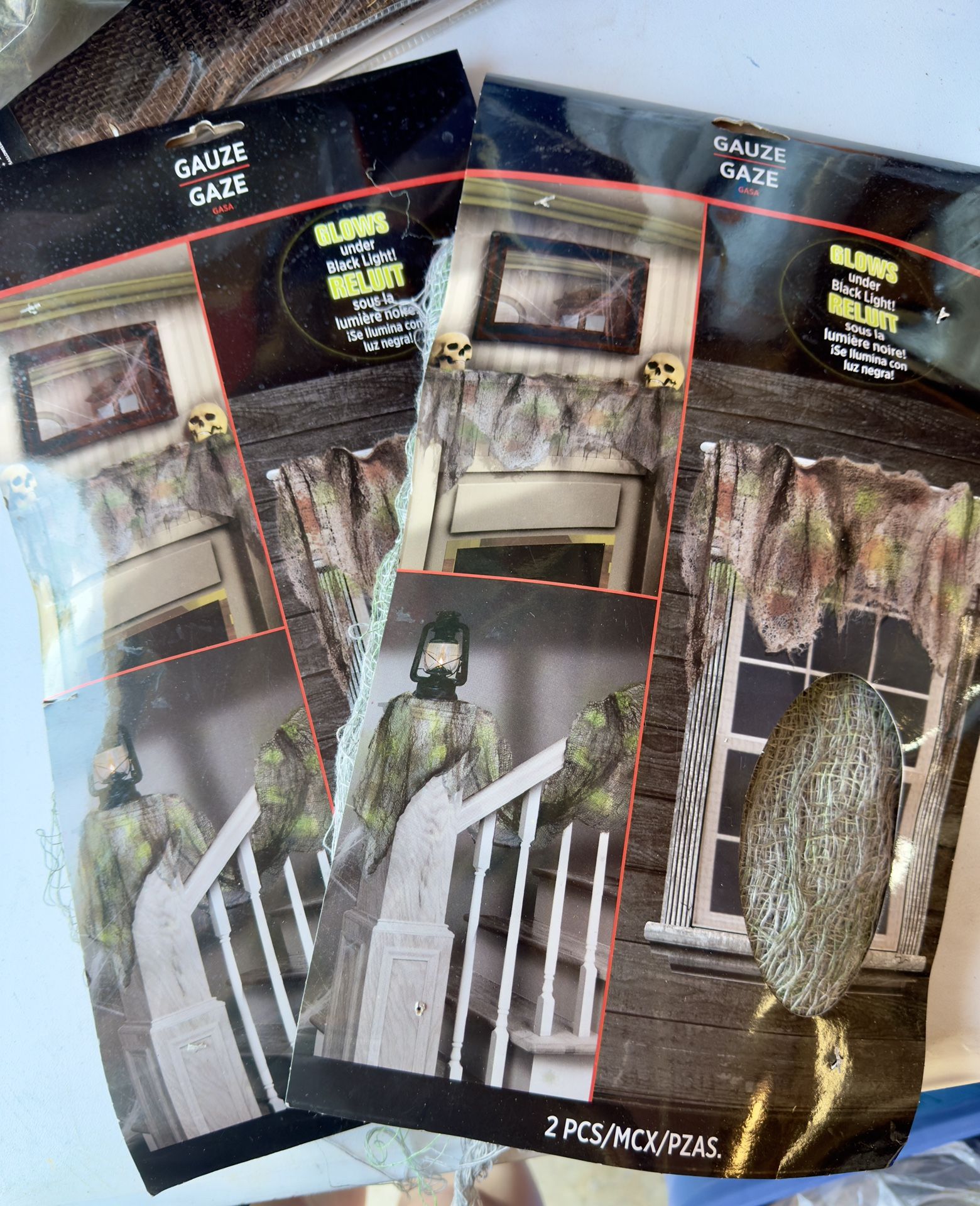 2 packs of Halloween gauze, brand new! Glows under black light!