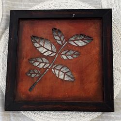 Metal framed leaf wall decor