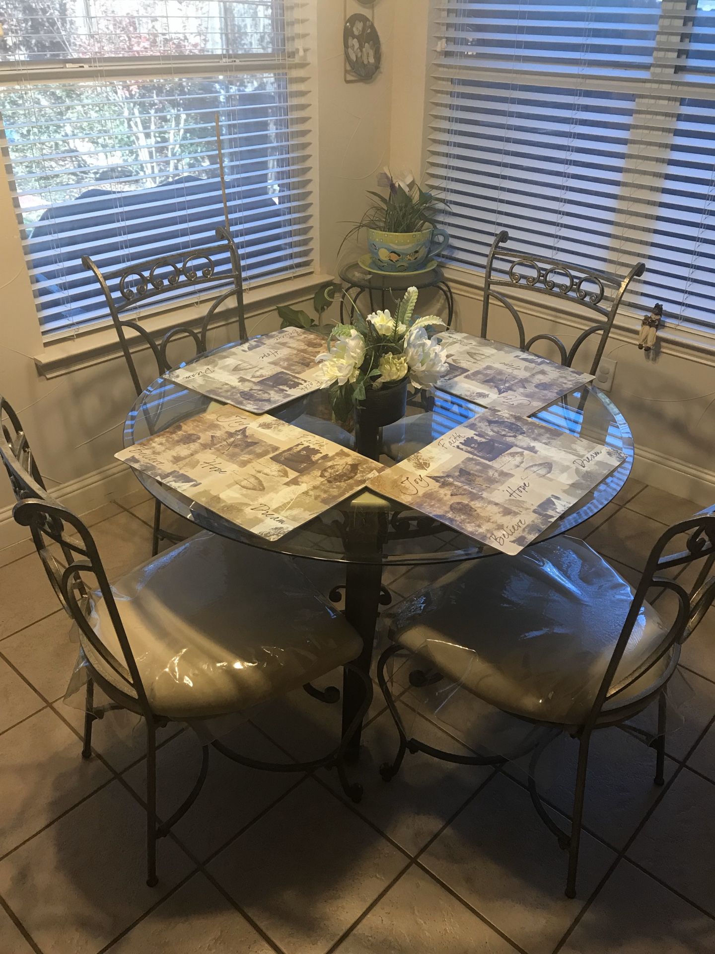 Glass kitchen table for sale with 4 chairs