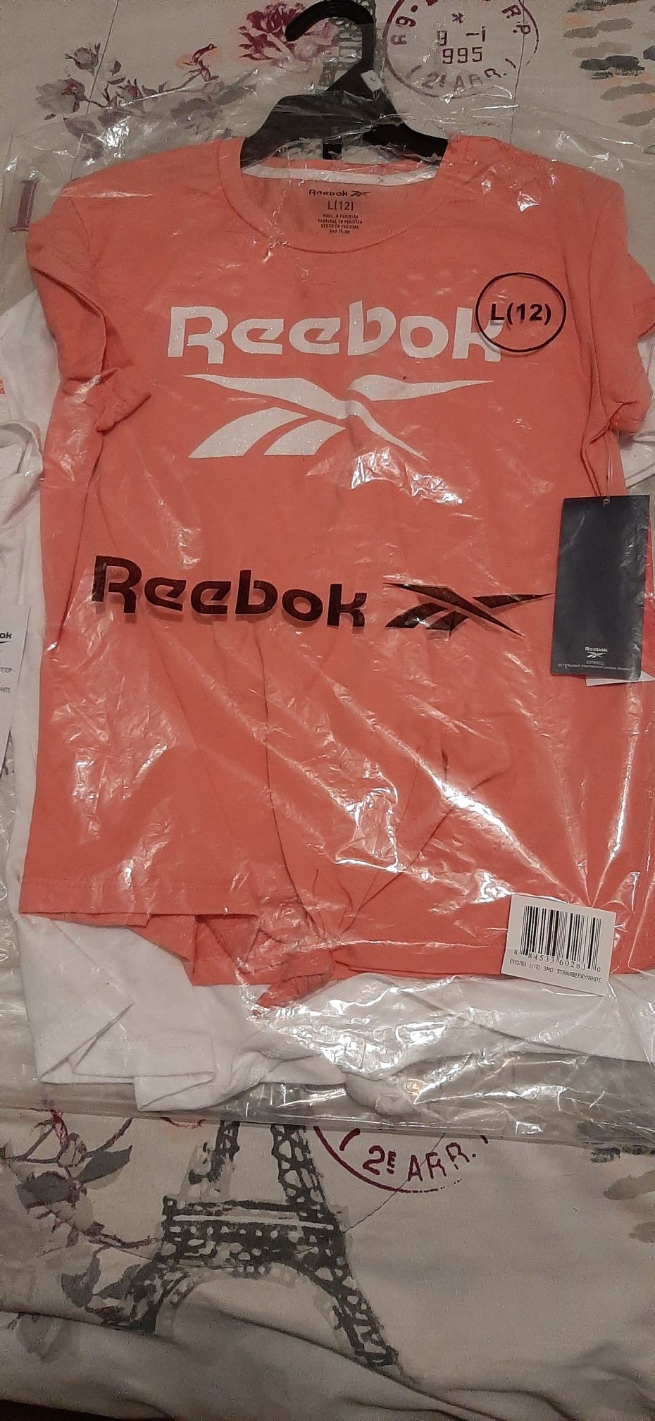 Pink and white Reebok shirts