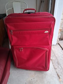 3 red samsonite suitcases