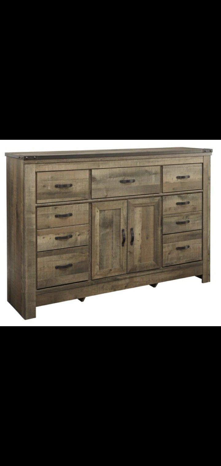 Trinell Brown Dresser with Fireplace Option | B446