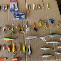 Fishing lures light tackle use. Includes plastic box containers and a Rapala fillet knife.