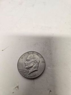 1977 Eisenhower Dollar, a large one-dollar coin featuring President Dwight D. Eisenhower Not silver