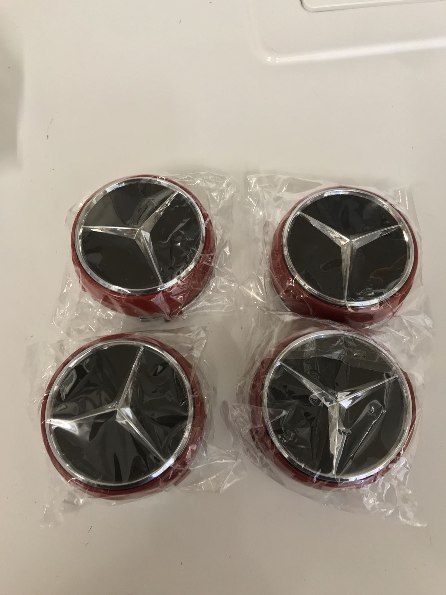 UNIVERSAL MERCEDES-BENZ AMG RAISED WHEEL CENTER CAPS RED WITH BLACK CENTERS BRAND NEW NEVER INSTALLED PRICED TO SELL FAST