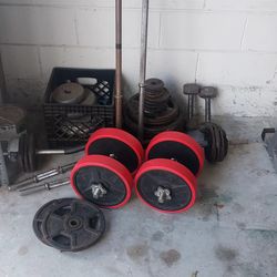 Assorted weight plates and bars
