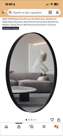 Oval metal frame mirror