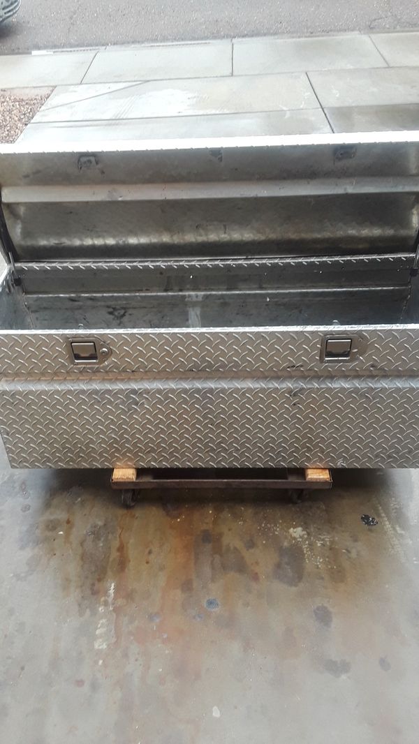 Diamond plate truck tool box.48 inchs wide side to side, 19 inchs deep