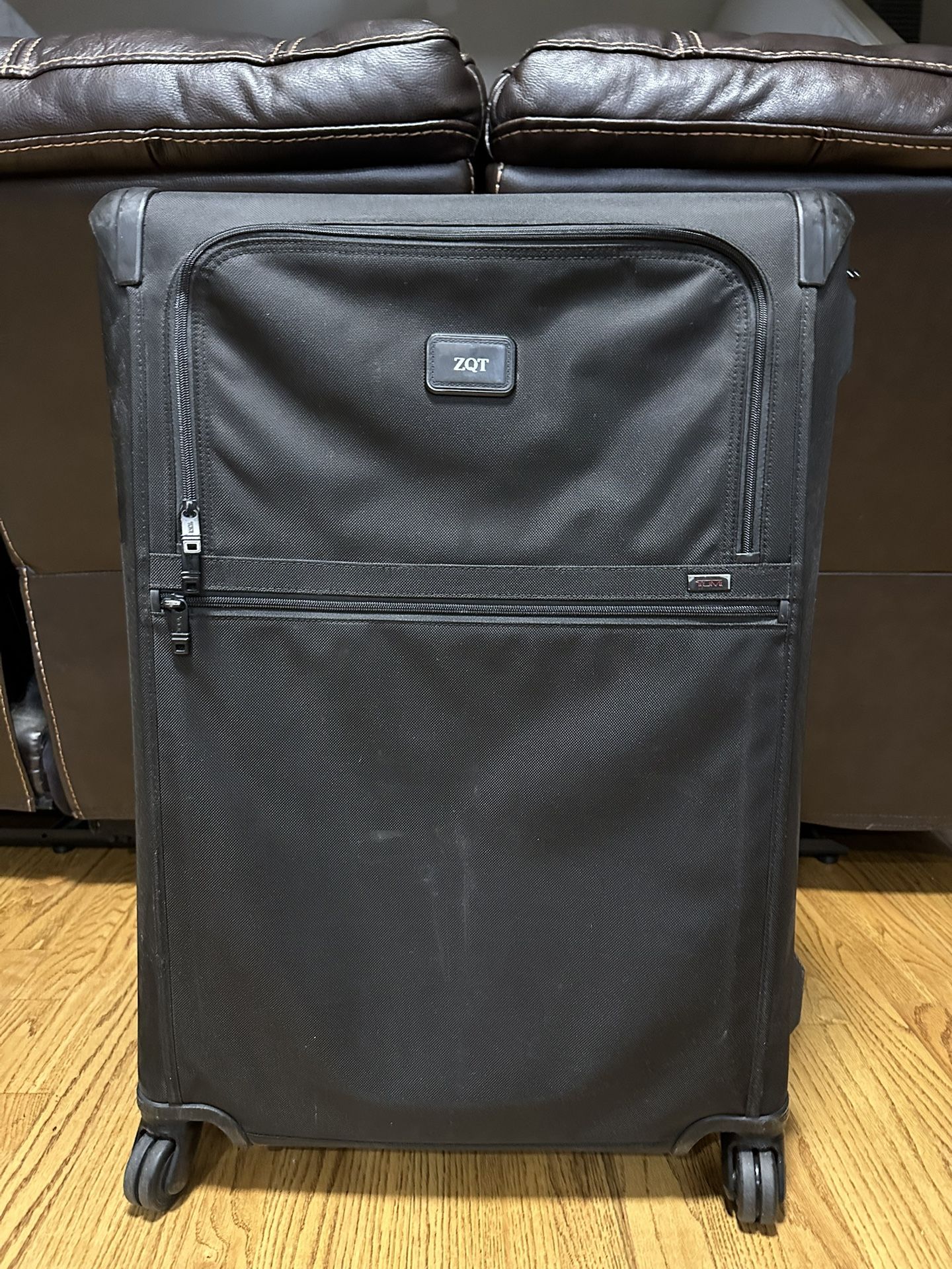 Used Tumi Alpha 2 suitcase. Great for extended travel or international flights. Has some cosmetic wear but still fully functional. Retail MSRP is arou