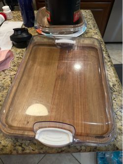 Cutting board with locking lid