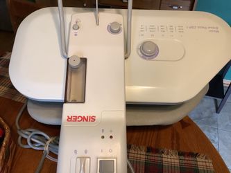 Singer Magic Steam Press Model CSP1 designed for crafting and laundry use.The unit features multiple fabric settings including Nylon, Silk, Wool, Cott